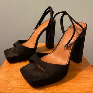 Platform block heels and ankle strap. Five inch heels with 1-1.5 inch platform